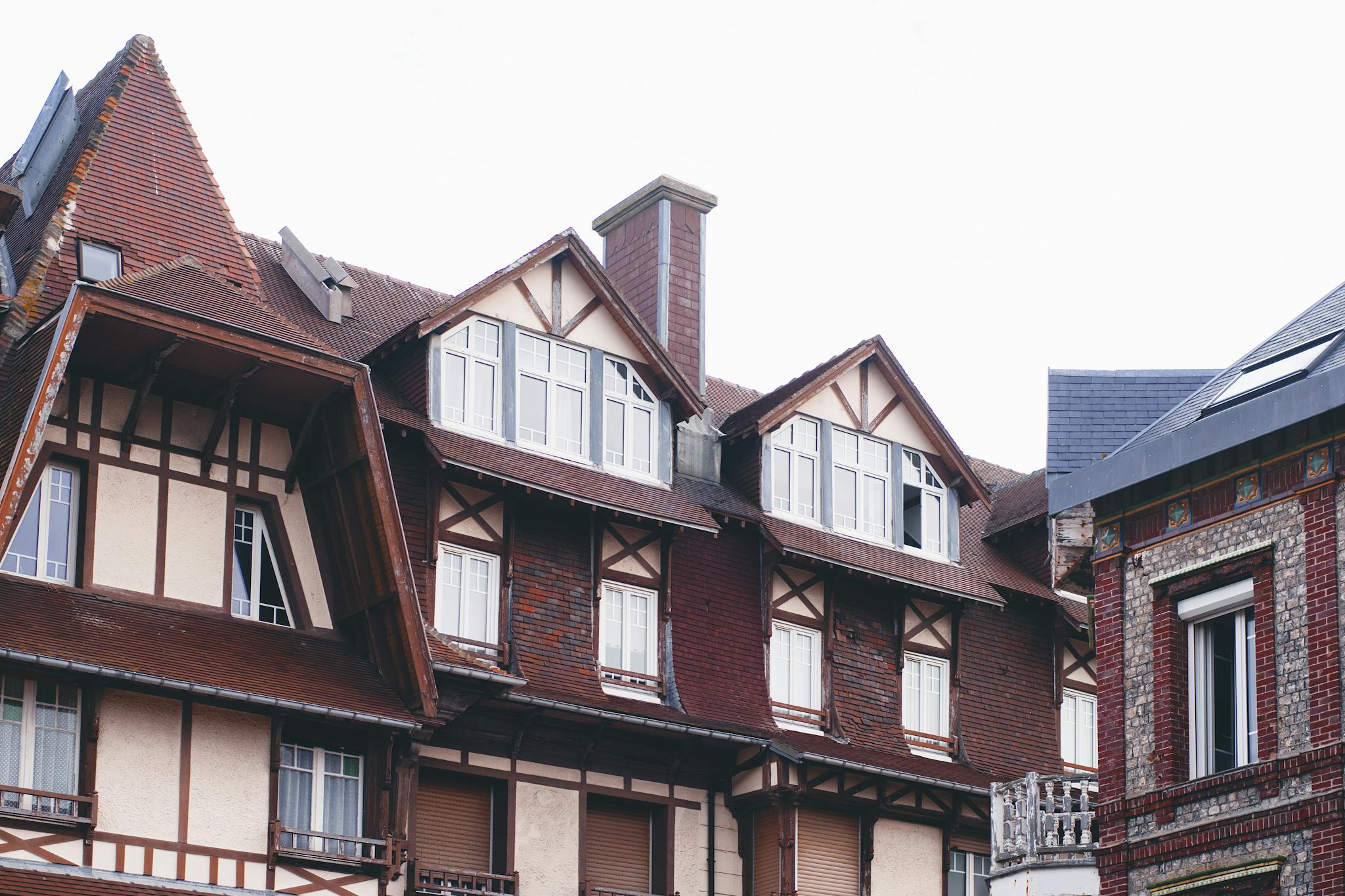 Elegant half-timbered house in a residential area showcasing classic architecture.